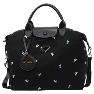 Black nylon travel duffel bag large capacity weekend tote bag with leather handles and bow prints.