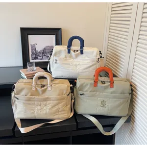 Large capacity travel duffel bag with separate shoe compartment and comfortable handles.