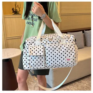 Black and white polka dot travel duffel bag with large capacity, shoulder strap and pockets.