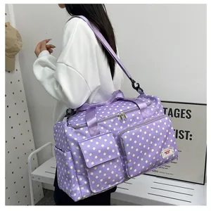 Purple polka dot travel duffel bag with large capacity, multi-pocket design, and shoulder strap.