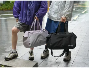 Detailed view of large capacity travel duffel bag showing dry wet separation design.