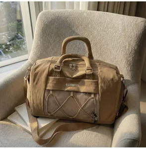 Khaki large capacity travel duffel gym bag with multi-pockets and front mesh storage pocket detail.