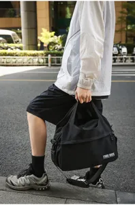 Casual nylon travel duffel bag with shoulder strap, large capacity and lightweight design.