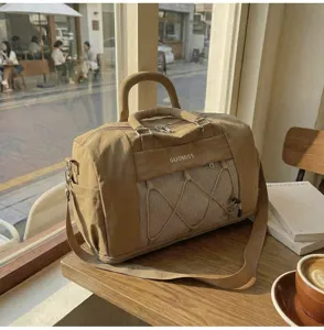 Large capacity casual travel duffel bag with shoulder strap and stylish mesh pocket design.