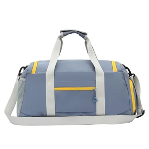Large capacity gym duffel bag in grey blue with yellow zippers for travel and sports fitness.