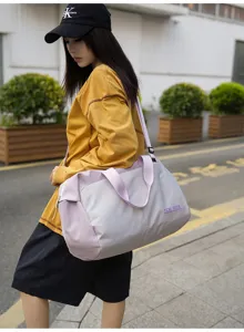 Nylon travel gym duffel bag for women, waterproof sports shoulder bag with wet dry compartment.