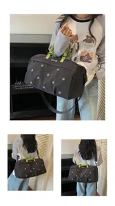 Large capacity travel duffel bag with green handles, stylish waterproof weekender bag.