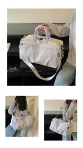 Large capacity travel duffel bag with dry-wet separation, purple handles and shoulder strap.