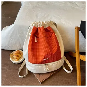 Sac à dos à cordon portable avec séparation sec-humide, idéal pour le sport, la salle et la plage.