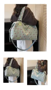 Large capacity corduroy travel bag with cute strawberry pattern, shoulder and handle.