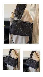 Large capacity travel duffel bag with cute strawberry print, shoulder strap for short trips.