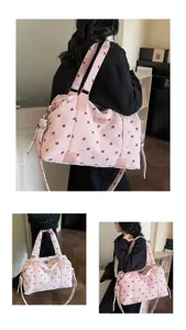 Pink corduroy travel bag with cute strawberry print, large capacity weekend duffel for women.