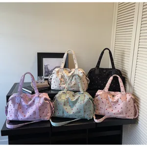 Large capacity travel duffel bag with cute strawberry print for women weekend.