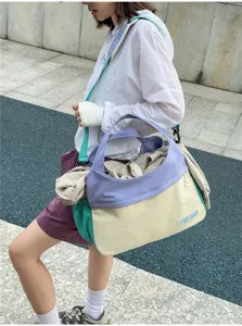 Detail view of the colorful color-block casual shoulder travel bag, large capacity.
