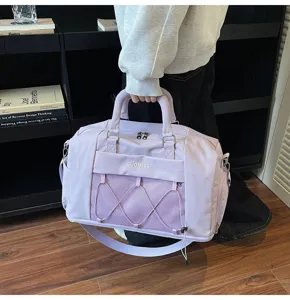 Detailed view of the large capacity lavender travel fitness bag with mesh pocket and elastic cord.