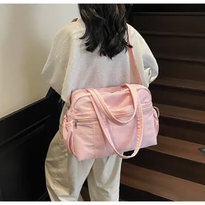 Rosa große Reisetasche für Sport und Kurztrips, wasserdichtes Material mit Doppelgriffen.