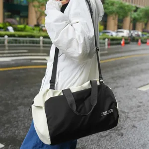 Water-resistant nylon travel duffel bag with dry wet separation for gym yoga sports.