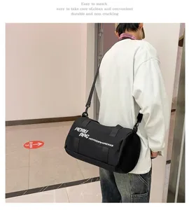Black cylindrical sports duffel bag with large capacity, ideal for travel and gym use.