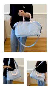 Light blue travel duffel bag with pink handles and cute bow embroidery, large capacity.