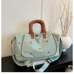 Large capacity travel duffel bag with bow embroidery, waterproof gym bag for women and men.