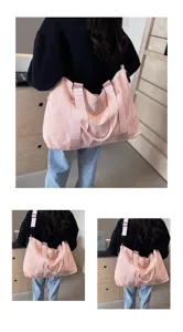 Large capacity pink travel bag gym duffel with dual handles and wide adjustable strap.