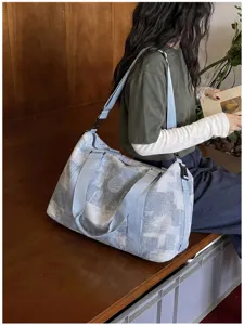 Large capacity travel duffel bag with stylish patterned texture, multi-functional fitness bag.