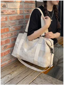 Detail shot of a retro canvas travel duffel bag with large capacity and multi-functional.