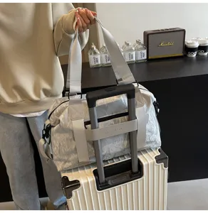 Detailed view of the large capacity travel duffel bag with trolley sleeve and handle.