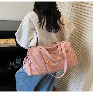 Large capacity pink travel duffel bag waterproof fitness shoulder bag with chic bow detail.