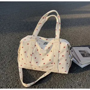 Corduroy travel duffel bag with strawberry print, large capacity for weekend and gym use.