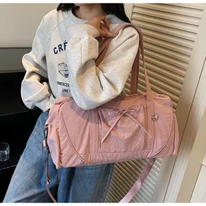 Large capacity pink shoulder duffel bag for short travel fitness and daily use.