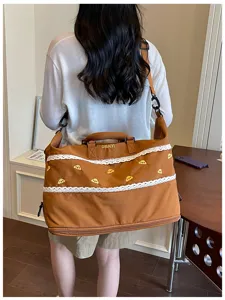 Large capacity brown travel duffel bag with lace trim and cute embroidery for daily use.