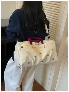 Travel duffel bag with wet-dry compartment, large capacity gym bag for short trips and sports.