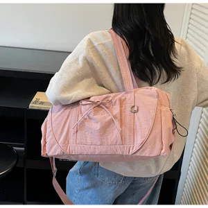 Pink large capacity shoulder duffel bag for short travel and fitness with dry wet separation.