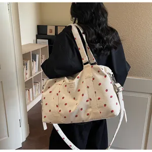 Large capacity corduroy travel duffel bag with cute strawberry pattern, shoulder strap.