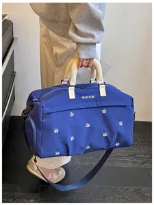 Detailed view of large capacity blue travel duffel bag with dry wet separation for gym and trips.