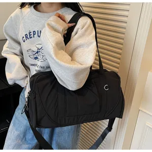 Large capacity black travel duffel bag, waterproof fitness shoulder bag with dry separation.