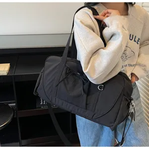 Large capacity black duffel bag, waterproof travel luggage and fitness shoulder bag for daily use.