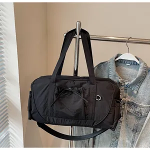 Black large capacity travel duffel bag with shoulder strap, waterproof fitness gym bag.