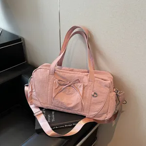Large capacity pink travel duffel bag with shoulder strap, waterproof fitness and gym bag.