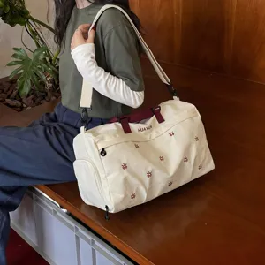 Large capacity travel duffel bag with dry wet separation, stylish canvas gym bag for trips.