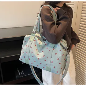 Corduroy travel shoulder bag with cute strawberry pattern, large capacity for daily trips.