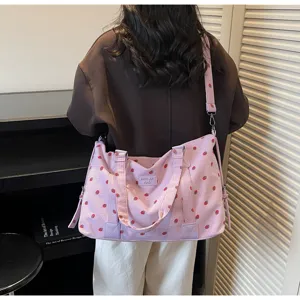 Pink corduroy travel bag with cute strawberry print, casual large shoulder crossbody weekender bag.