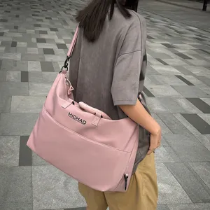 Large capacity pink travel fitness bag, waterproof gym handbag for women short trips.