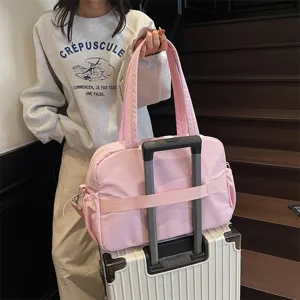 Rosa Reise-Dufflebag für Damen, große wasserdichte Wochenendtasche mit Trolley-Haltegurt.