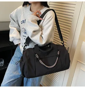Gran bolsa de viaje negra con asa trenzada de color para el gimnasio y viajes de negocios.