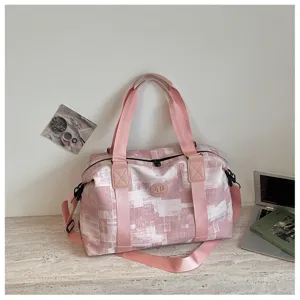Pink gym travel bag large capacity fitness duffel bag with shoulder strap and stylish PU texture.