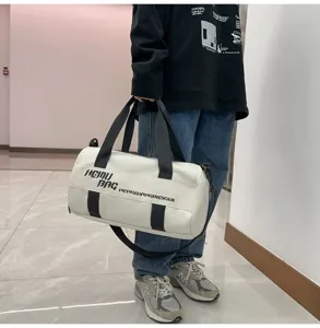 White cylindrical sports duffel bag with black straps and large capacity for fitness and travel.
