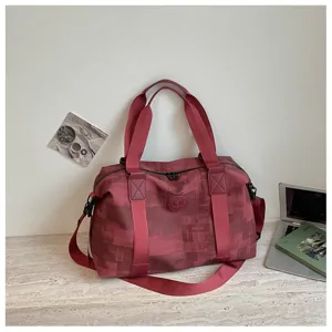 Retro burgundy PU travel duffel bag detail, large capacity gym bag with sturdy handles.