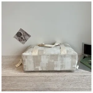 Detailed view of large capacity travel duffel bag with textured PU fabric and sturdy straps.